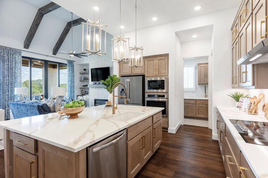 Kitchen with open floor plan, stainless steel appliances, backsplash, and wall chimney exhaust hood Kitchen with open floor plan, stainless steel appliances, backsplash, and wall chimney exhaust hood