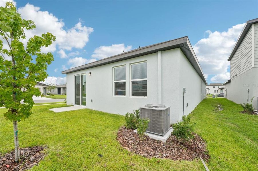 Front exterior of a new home in The Grove at Stuart Crossing - Premier Series, Bartow, FL, highlighting curb appeal (Image 1). Front exterior of a new home in The Grove at Stuart Crossing - Premier Series, Bartow, FL, highlighting curb appeal (Image 1).