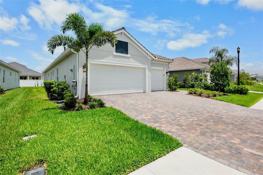 Front exterior of a new home in , Sarasota, FL, highlighting curb appeal (Image 2). Front exterior of a new home in , Sarasota, FL, highlighting curb appeal (Image 2).