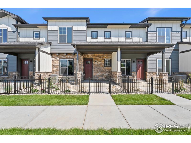 Front exterior of a new home in The Lakes at Centerra - Discovery, Loveland, CO, highlighting curb appeal (Image 2).