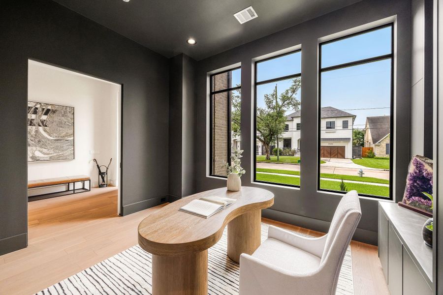The expansive windows, creating a light-filled workspace that is as inspiring as it is elegant.