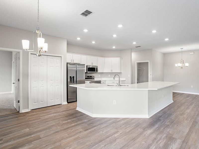 Ample dining space is available thanks to the island, sunny cafe, and formal dining room  - Willow II by Highland Homes