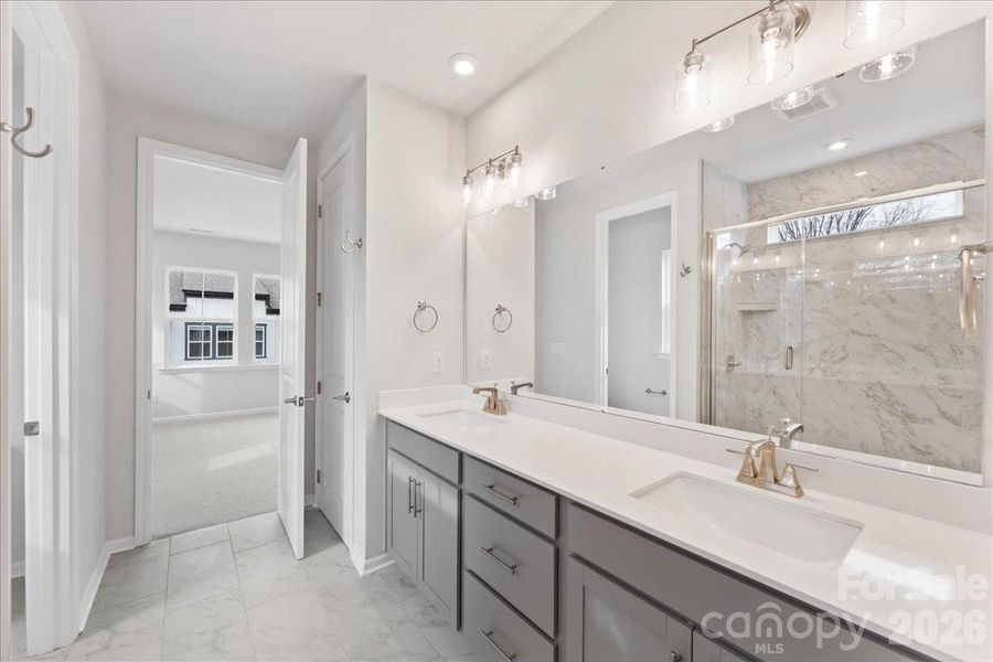 Primary Suite with Dual Sink Bathroom and Walk-In Shower Primary Suite with Dual Sink Bathroom and Walk-In Shower