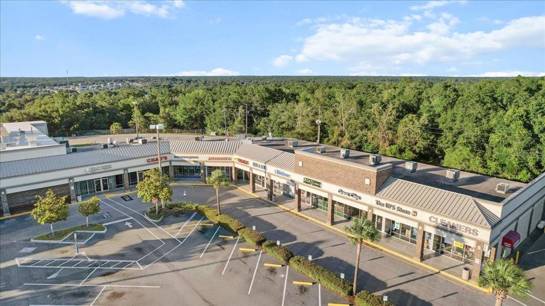 Front exterior of a new home in Twisted Oaks, Beverly Hills, FL, highlighting curb appeal (Image 21).