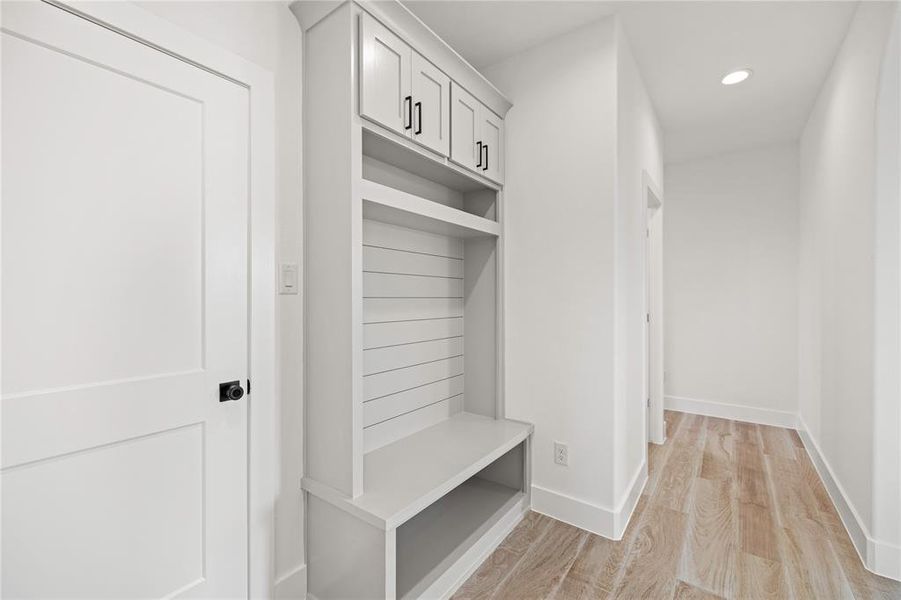 Mudroom with light wood-style flooring and recessed lighting Mudroom with light wood-style flooring and recessed lighting