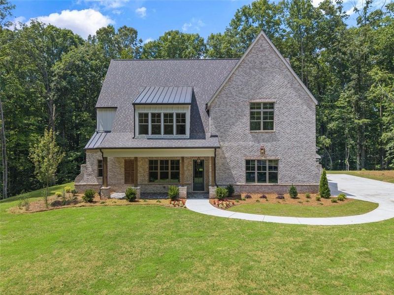 Front exterior of a new home in , Woodstock, GA, highlighting curb appeal (Image 25).