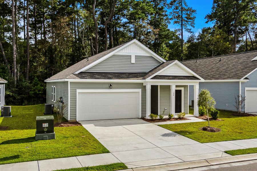 Representative exterior photo of a completed home built from the Sterling by Starlight Homes in Spring Grove, Aynor, SC (Image 25). Representative exterior photo of a completed home built from the Sterling by Starlight Homes in Spring Grove, Aynor, SC (Image 25).