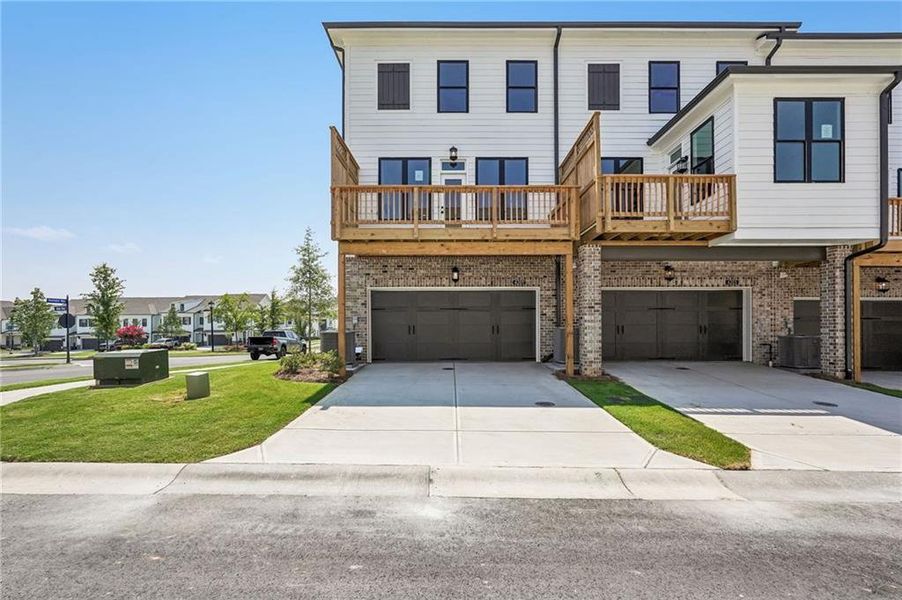 Front exterior of a new home in Millcroft Townhomes, Buford, GA, highlighting curb appeal (Image 31). Front exterior of a new home in Millcroft Townhomes, Buford, GA, highlighting curb appeal (Image 31).