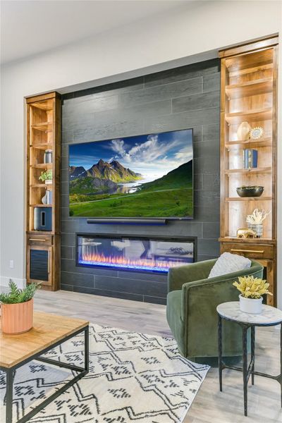 Home theater featuring and a large fireplace Home theater featuring and a large fireplace