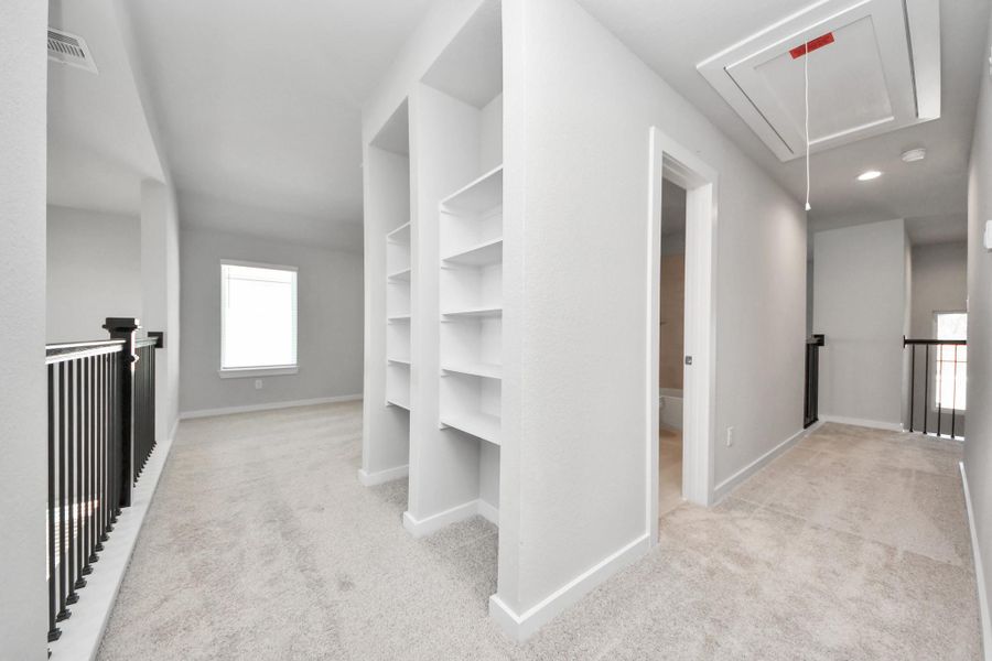 Ascend to relaxation in this fantastic game room! Ideal for both casual gatherings and adult gaming, it boasts plush carpet, lofty ceilings, custom paint, and ample windows for abundant natural light. Sample photo of completed home with similar floor plan. Actual colors and selections may vary. Ascend to relaxation in this fantastic game room! Ideal for both casual gatherings and adult gaming, it boasts plush carpet, lofty ceilings, custom paint, and ample windows for abundant natural light. Sample photo of completed home with similar floor plan. Actual colors and selections may vary.