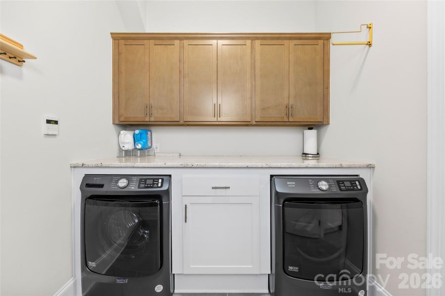 Mud Room / Laundry between Garage Beverage Bar area Mud Room / Laundry between Garage Beverage Bar area
