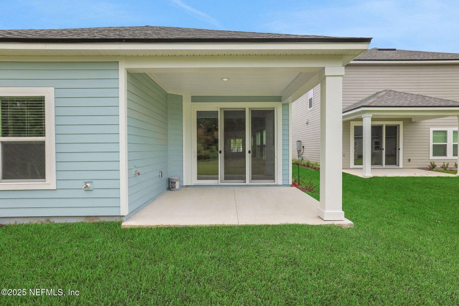 Front exterior of a new home in TrailMark, St. Augustine, FL, highlighting curb appeal (Image 27). Front exterior of a new home in TrailMark, St. Augustine, FL, highlighting curb appeal (Image 27).