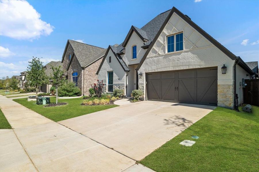 Front exterior of a new home in Cambridge Crossing 50', Celina, TX, highlighting curb appeal (Image 22). Front exterior of a new home in Cambridge Crossing 50', Celina, TX, highlighting curb appeal (Image 22).