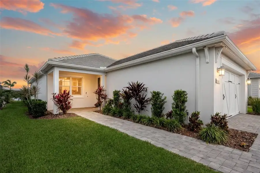Exterior details and patio area of a home in LakeHouse Cove at Waterside, Sarasota (Image 3). Exterior details and patio area of a home in LakeHouse Cove at Waterside, Sarasota (Image 3).