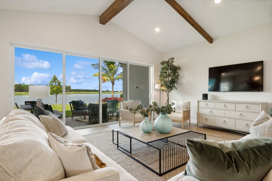 Great room with vaulted ceiling and ceiling beams