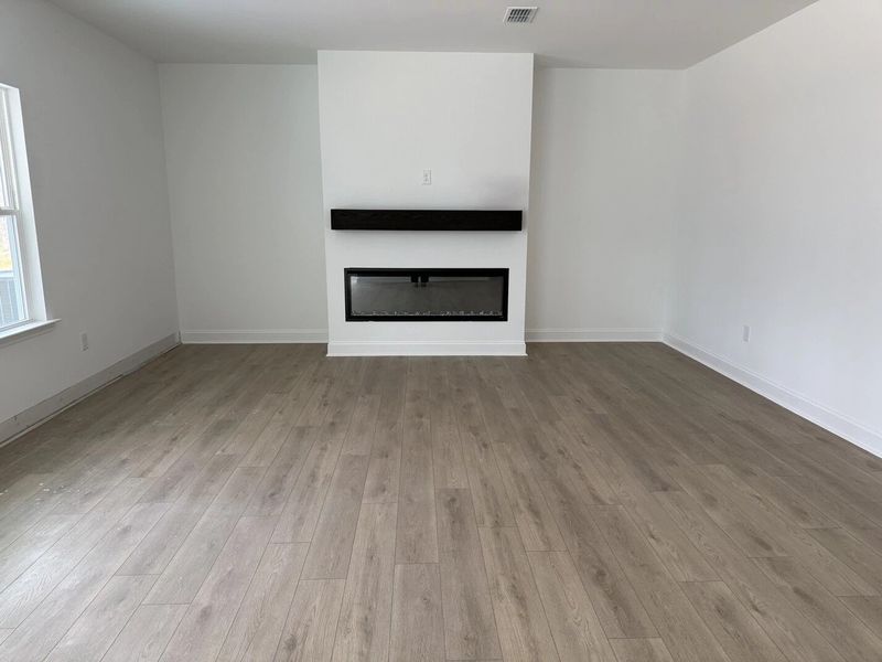 Family Room featuring the AW Collection® Coastal - Open and airy with soft-toned finishes. Family Room featuring the AW Collection® Coastal - Open and airy with soft-toned finishes.