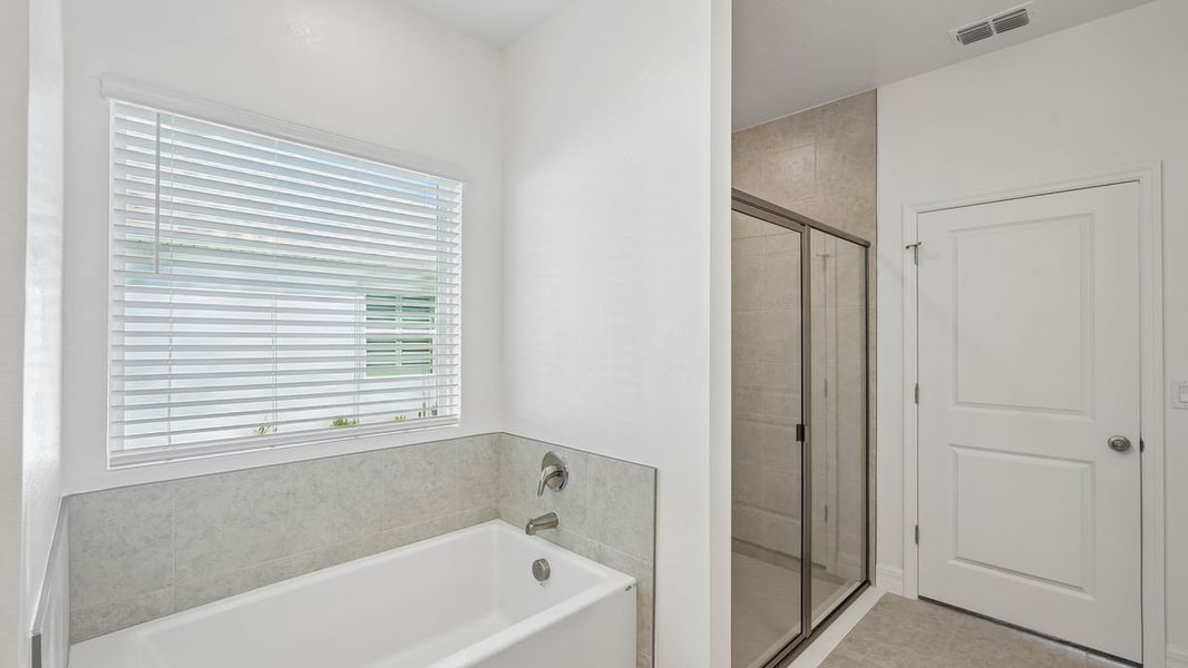 Furnished interior view inside a new home in Heritage Station, Punta Gorda (Image 10).