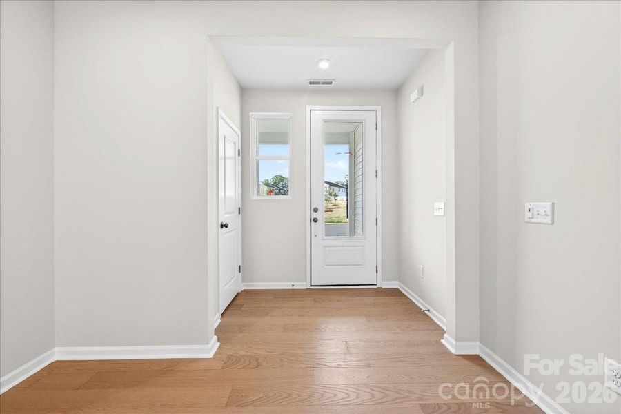 Foyer with first floor powder room Foyer with first floor powder room