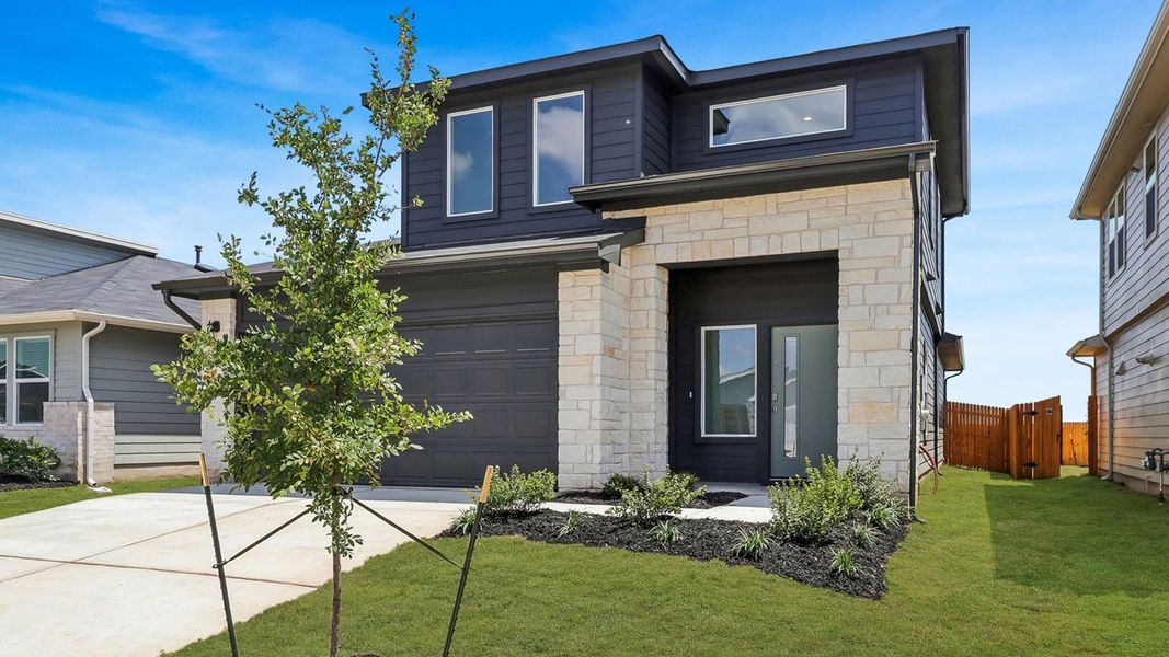 Front exterior of a new home in Southgrove, Kyle, TX, highlighting curb appeal (Image 20).