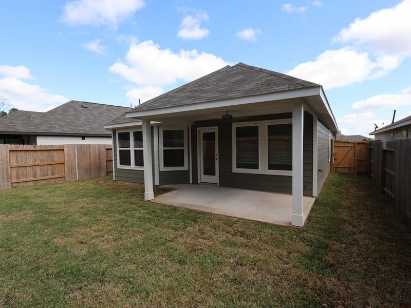 Exterior details and patio area of a home in Pinewood at Grand Texas, New Caney (Image 2).
