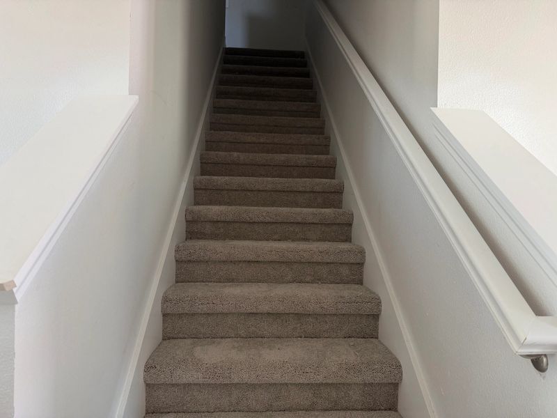 Staircase leads to second-floor bedrooms Staircase leads to second-floor bedrooms