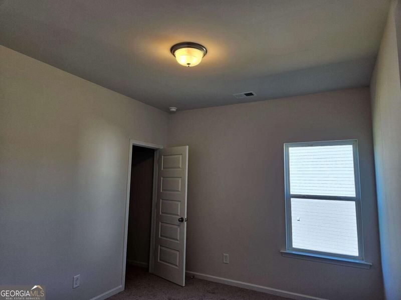Spacious, unfurnished interior of a new home in Maddox Station, Eatonton (Image 28).