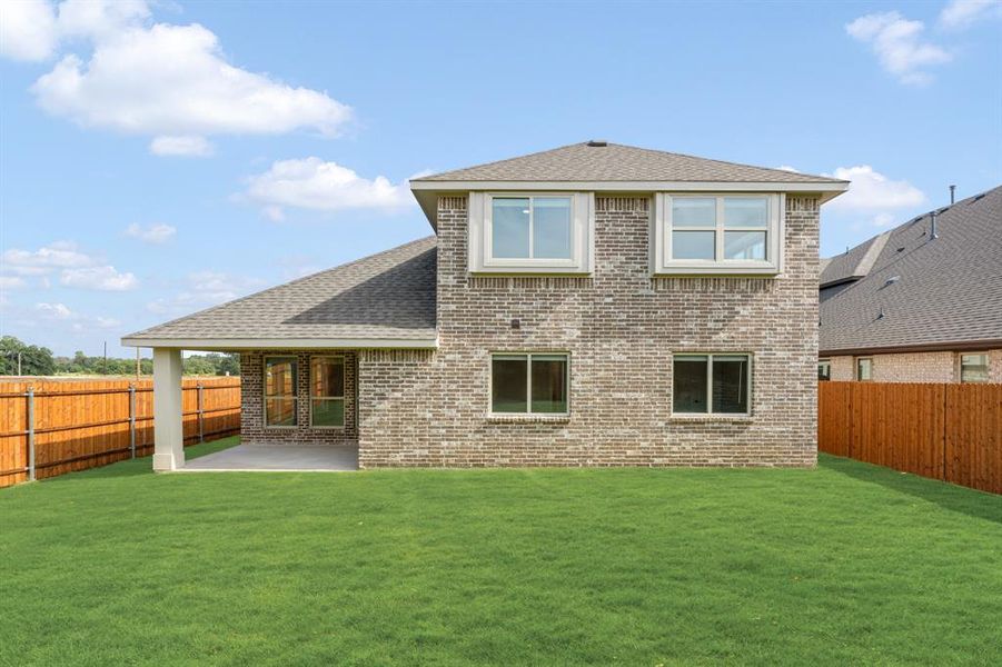 Front exterior of a new home in Glenwood Meadows, Denton, TX, highlighting curb appeal (Image 25). Front exterior of a new home in Glenwood Meadows, Denton, TX, highlighting curb appeal (Image 25).
