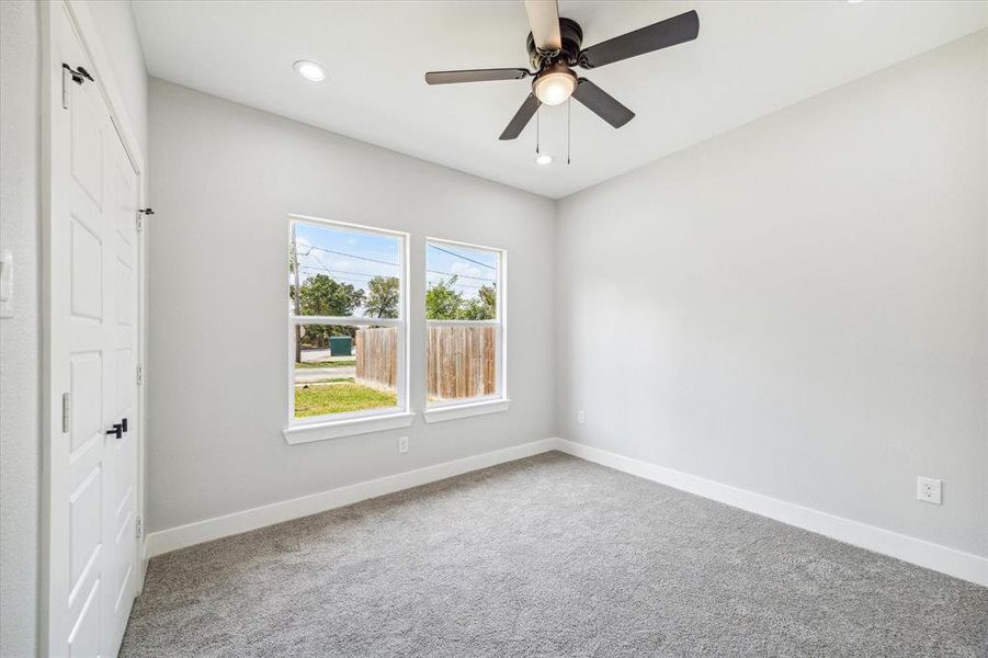 view of the secondary bedroom with plush carpeting