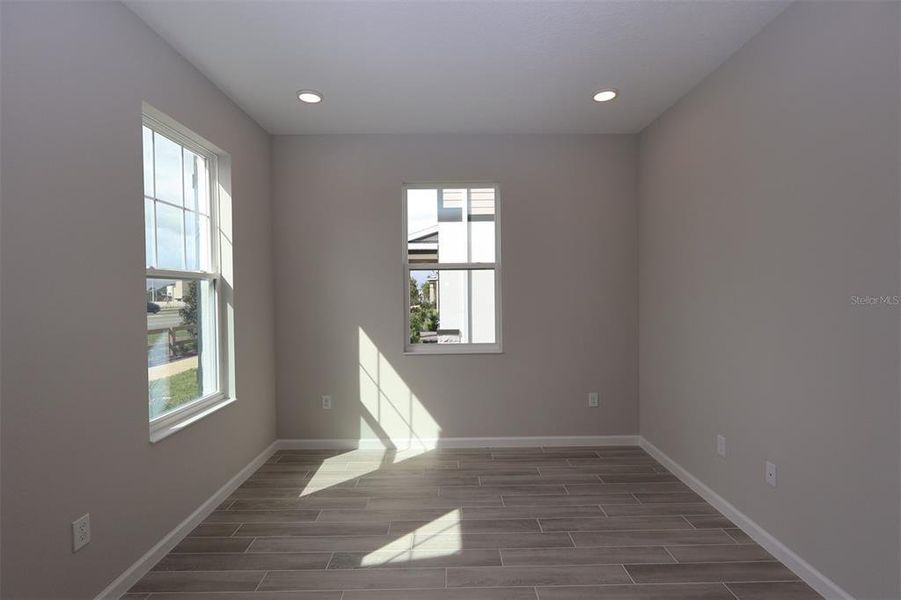Spacious, unfurnished interior of a new home in Tribute at Ovation, Winter Garden (Image 34).