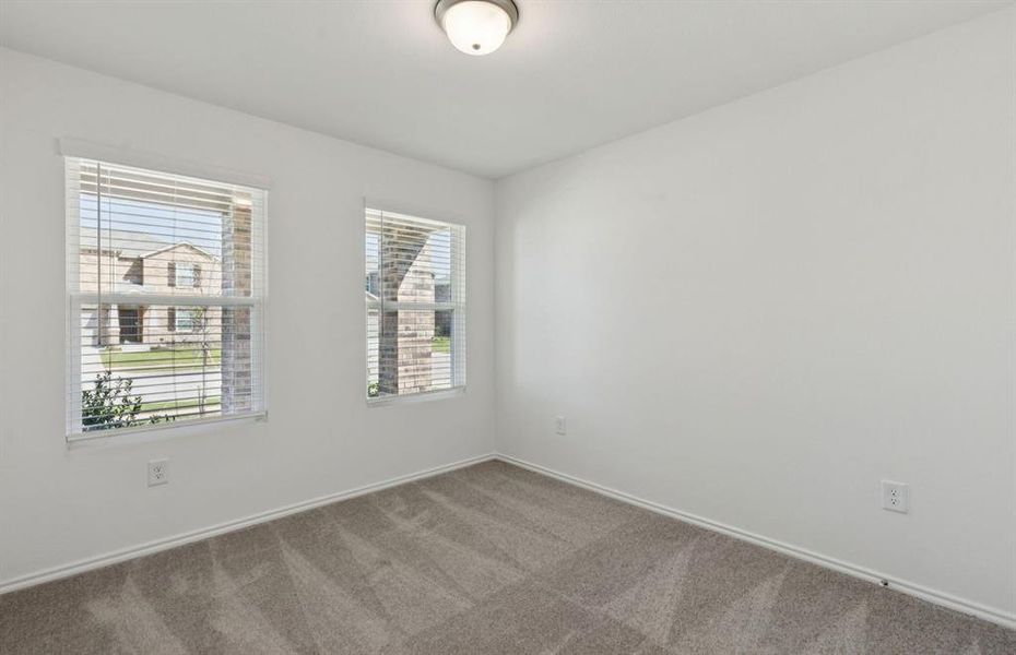 Spacious secondary bedroom with large windows Spacious secondary bedroom with large windows