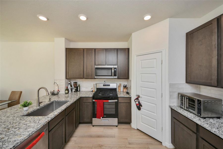 Furnished interior view inside a new home in Sunterra North, Katy (Image 16).