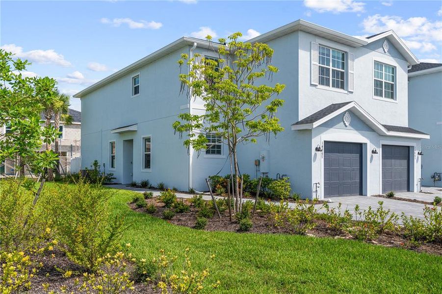 Front exterior of a new home in , Punta Gorda, FL, highlighting curb appeal (Image 25).