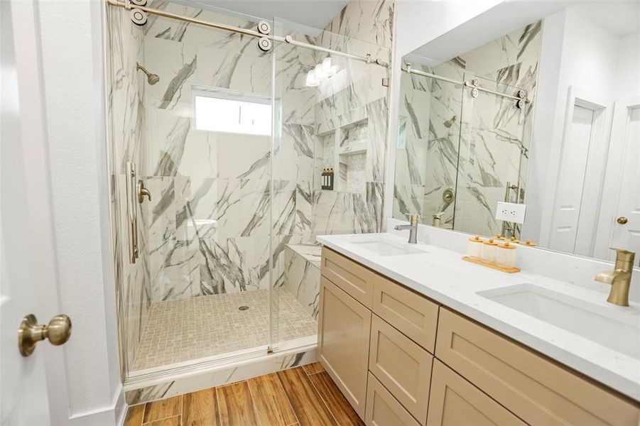 Luxurious primary bathroom with private toilet room and walk-in closet