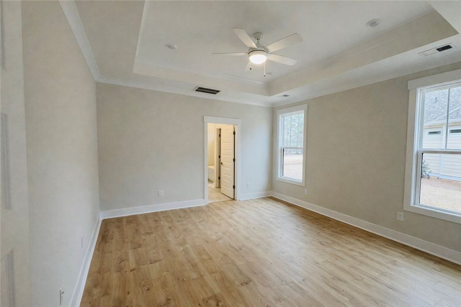 This spacious bedroom offers ample natural light a