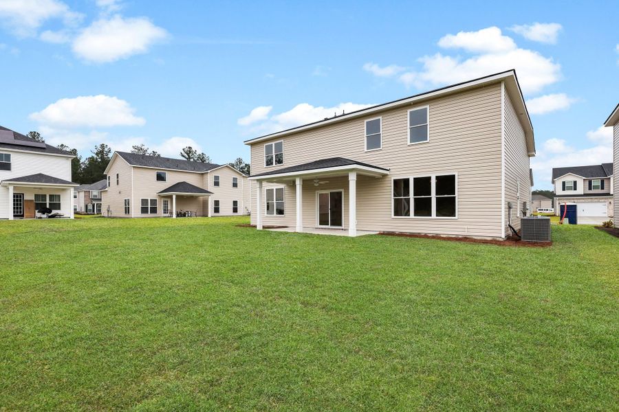 Front exterior of a new home in Camden Crossing, Savannah, GA, highlighting curb appeal (Image 23). Front exterior of a new home in Camden Crossing, Savannah, GA, highlighting curb appeal (Image 23).