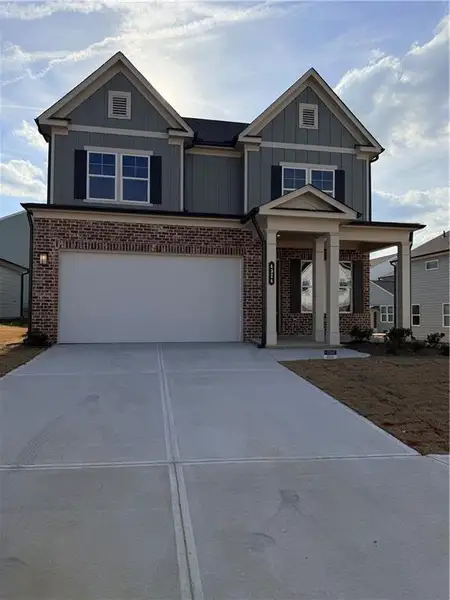 Front exterior of a new home in Annsbury Park, Lilburn, GA, highlighting curb appeal (Image 1). Front exterior of a new home in Annsbury Park, Lilburn, GA, highlighting curb appeal (Image 1).