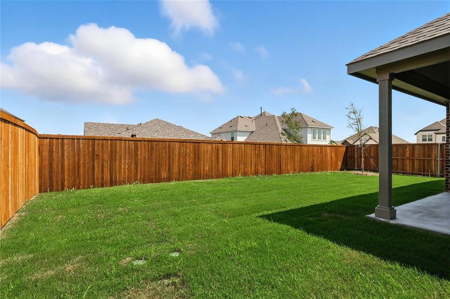 Fenced backyard with a patio Fenced backyard with a patio