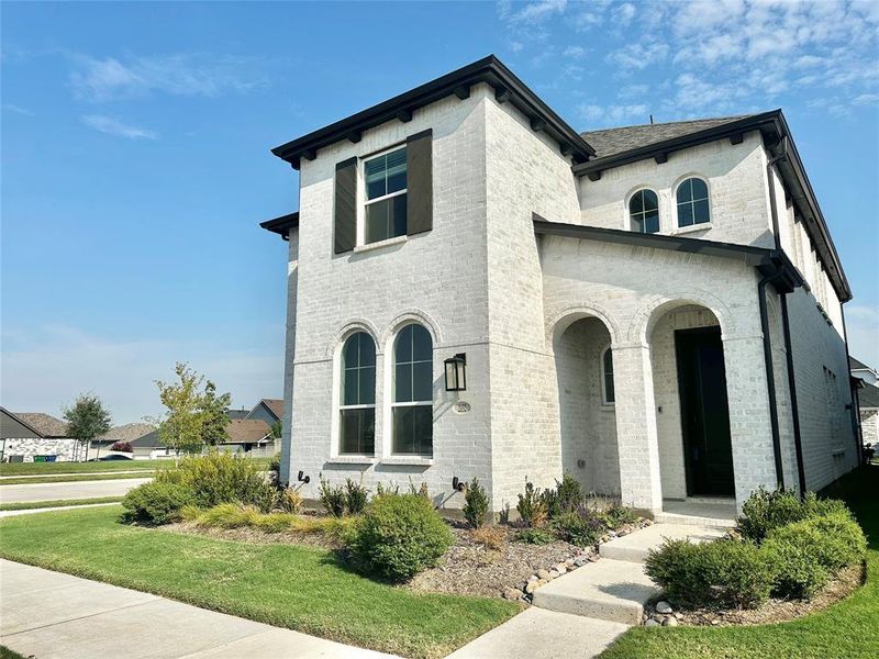 Front exterior of a new home in , Northlake, TX, highlighting curb appeal (Image 1). Front exterior of a new home in , Northlake, TX, highlighting curb appeal (Image 1).
