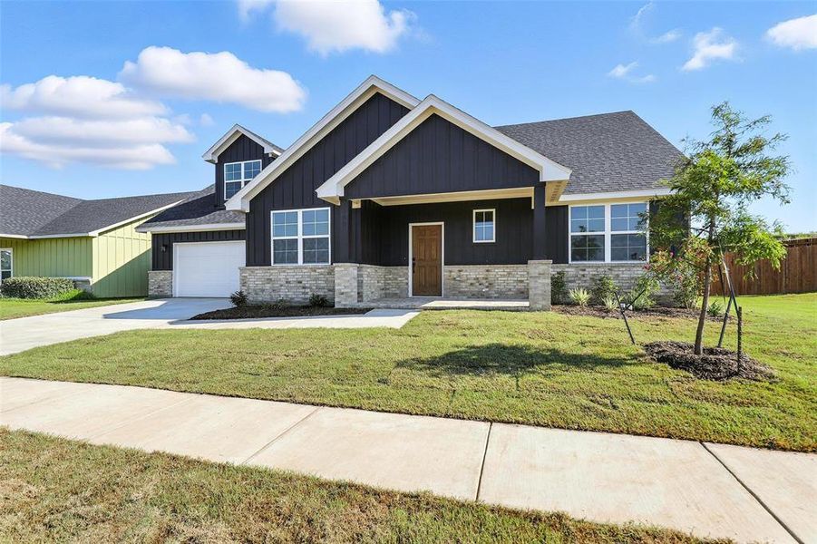 Front exterior of a new home in Stoneview, Glen Rose, TX, highlighting curb appeal (Image 23). Front exterior of a new home in Stoneview, Glen Rose, TX, highlighting curb appeal (Image 23).