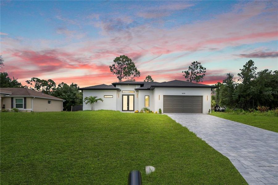 Front exterior of a new home in , North Port, FL, highlighting curb appeal (Image 1). Front exterior of a new home in , North Port, FL, highlighting curb appeal (Image 1).