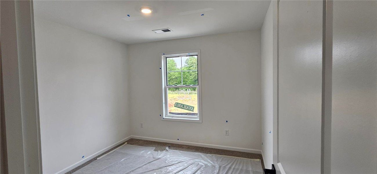 This bright room features a large window, offering