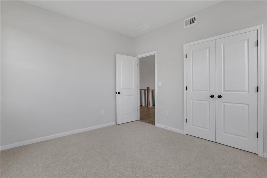 Spacious, unfurnished interior of a new home in The Paddocks at Doc Hughes, Buford (Image 38).