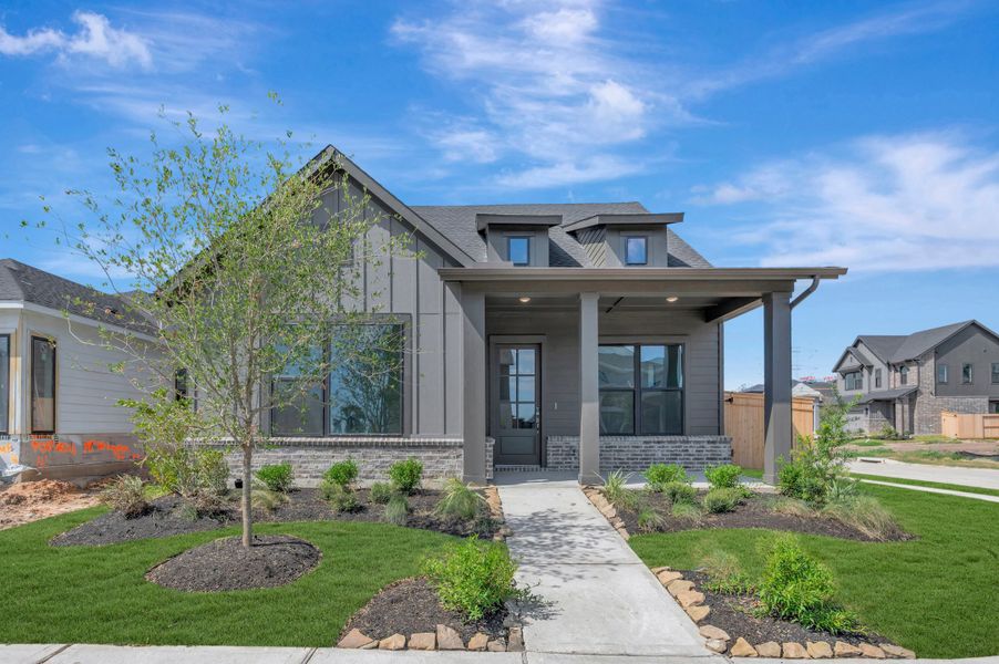 Front exterior of a new home in Sienna - Landmark Row Collection, Missouri City, TX, highlighting curb appeal (Image 2). Front exterior of a new home in Sienna - Landmark Row Collection, Missouri City, TX, highlighting curb appeal (Image 2).
