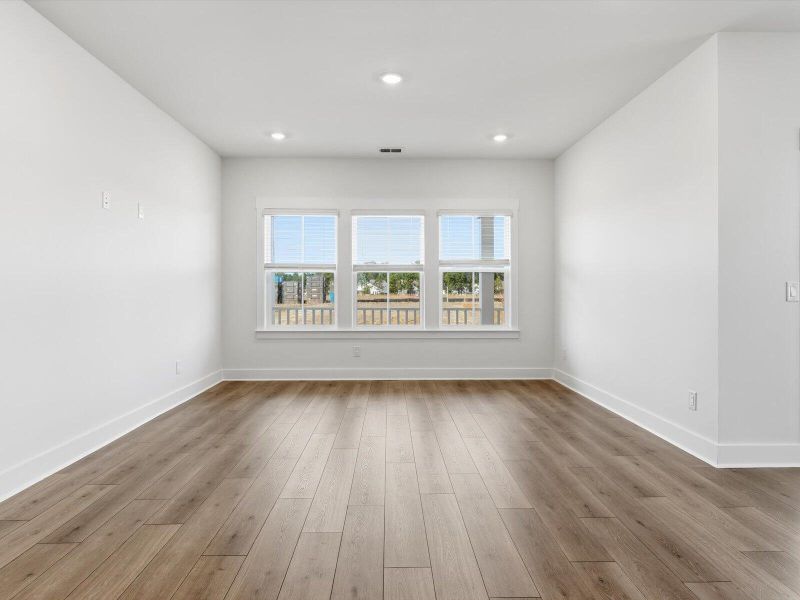 Spacious, unfurnished interior of a new home in The Coves at Lakes of Cane Bay, Summerville (Image 32).