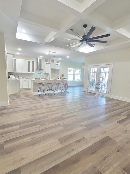 Custom designed tray ceilings, open concept living room and kitchen,  as well high ceilings throughout the home.
