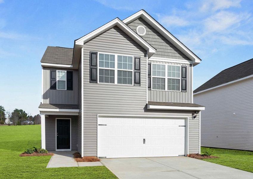 Burke house front with green grass, light brown paneling, and white two-car garage door