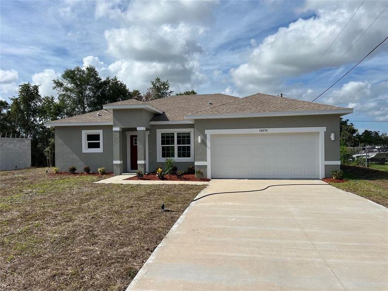 Front exterior of a new home in , Ocala, FL, highlighting curb appeal (Image 1). Front exterior of a new home in , Ocala, FL, highlighting curb appeal (Image 1).