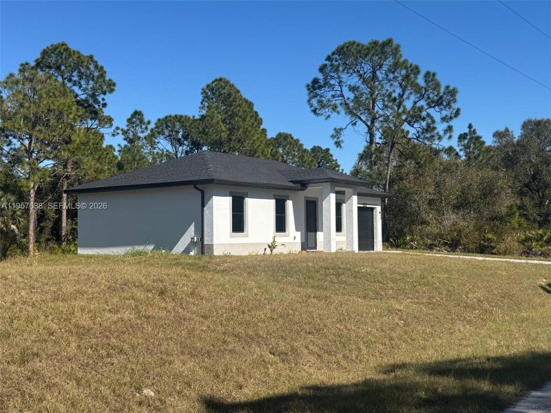 Exterior details and patio area of a home in , Lehigh Acres (Image 2). Exterior details and patio area of a home in , Lehigh Acres (Image 2).
