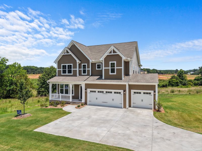 Front exterior of a new home in Ridgecrest at Midway, Anderson, SC, highlighting curb appeal (Image 2). Front exterior of a new home in Ridgecrest at Midway, Anderson, SC, highlighting curb appeal (Image 2).