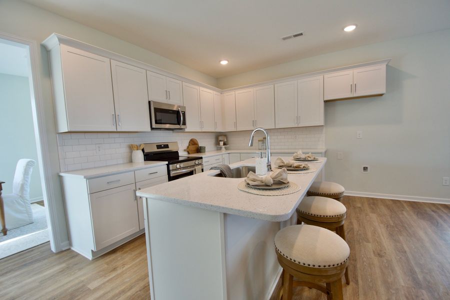 Representative furnished interior of a home built from the Madison by Stevens Fine Homes in Parkwood Estates, Leland (Image 6).